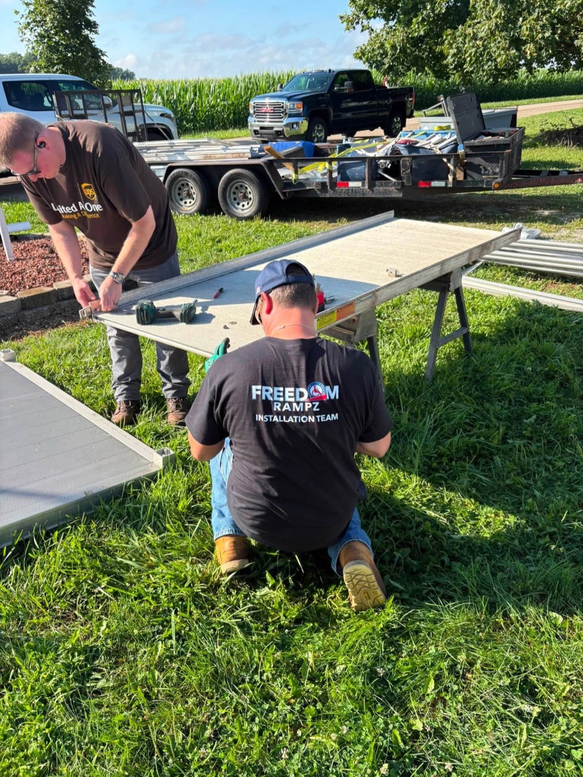 The Freedom Rampz install team assembling a ramp on site